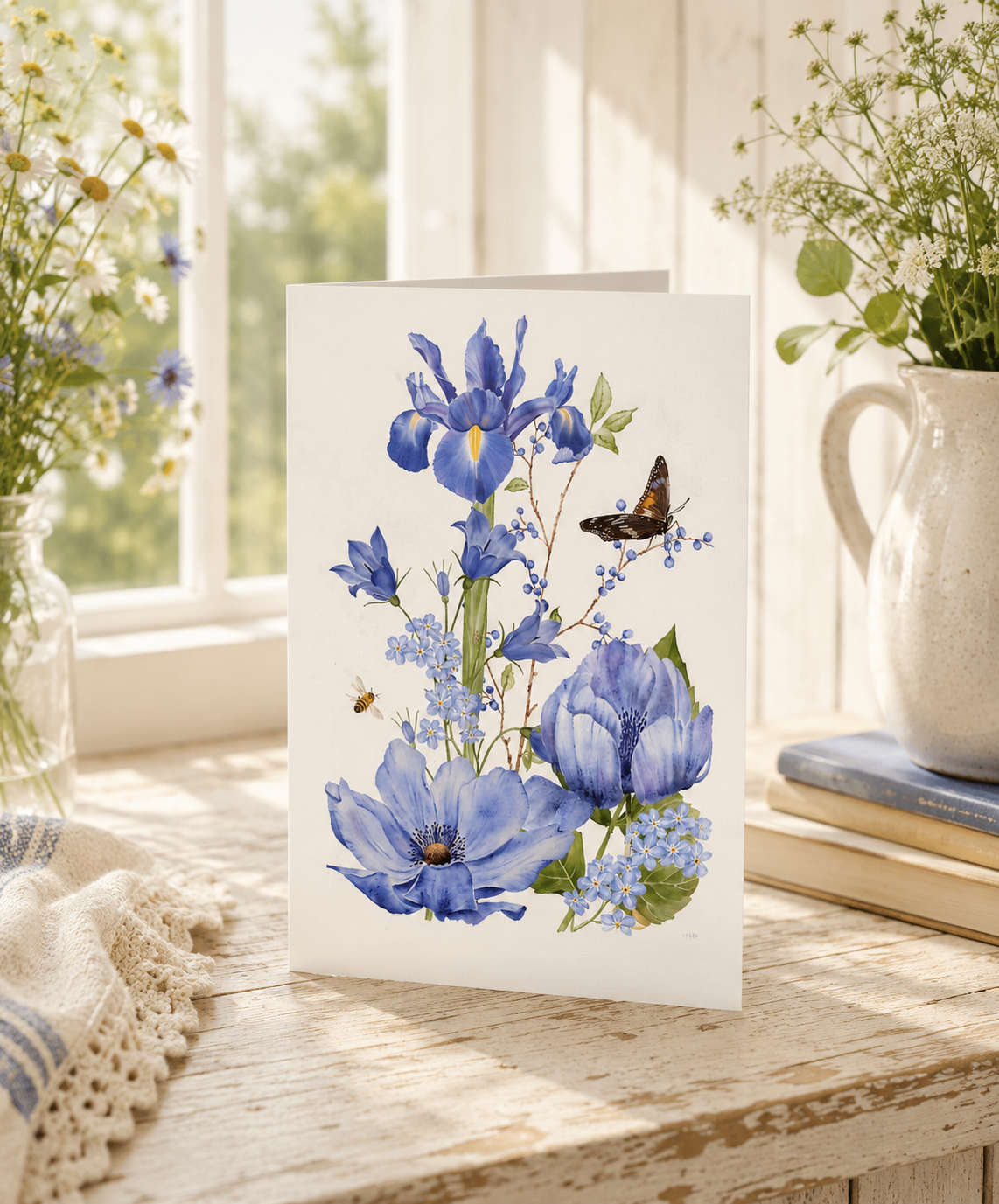 Watercolour blue iris and anemone bouquet with butterfly and bee greeting card by Gabrielle Marlow