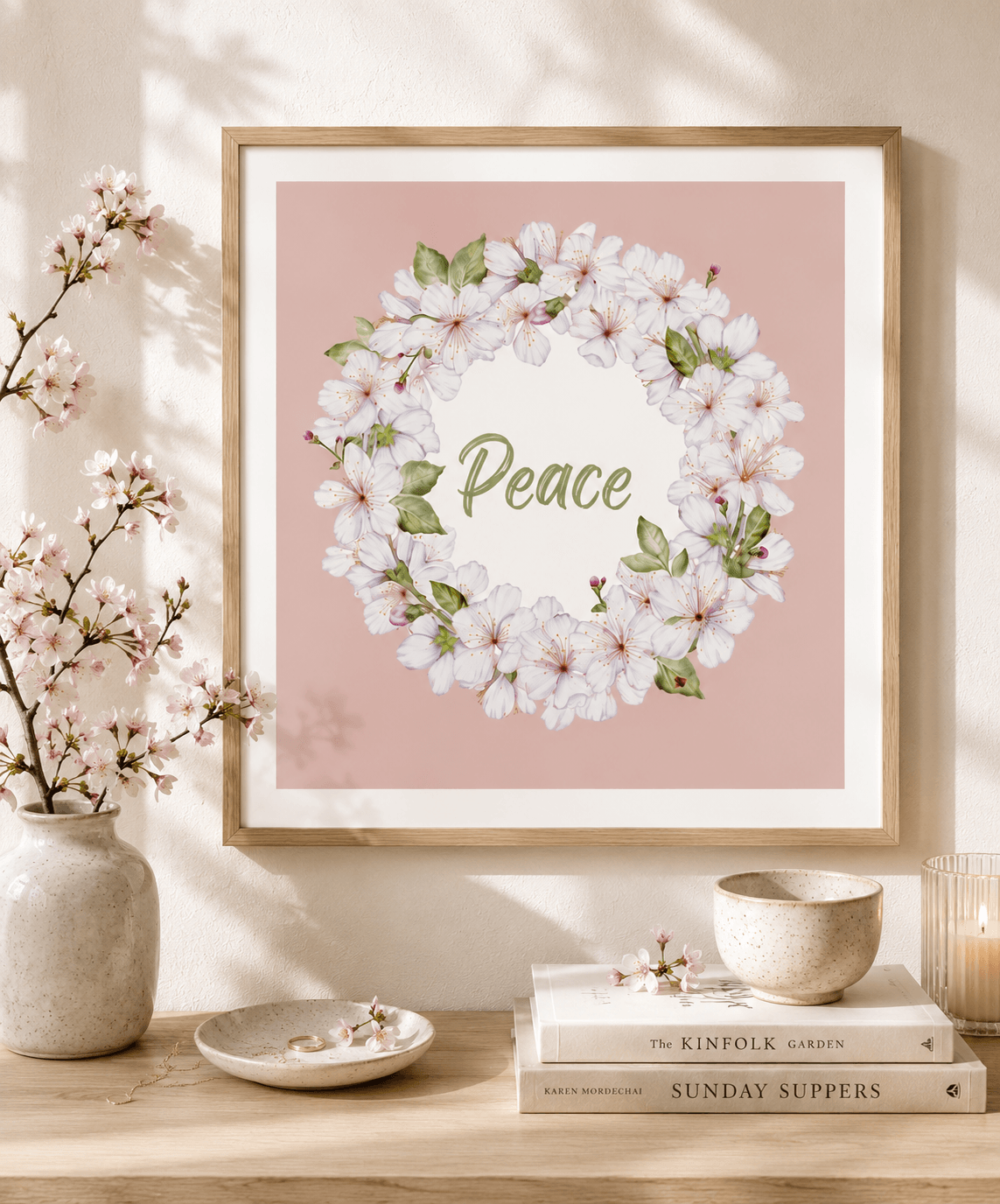 Framed cherry blossom wreath watercolour art print with the word "Peace" on a dusty pink background