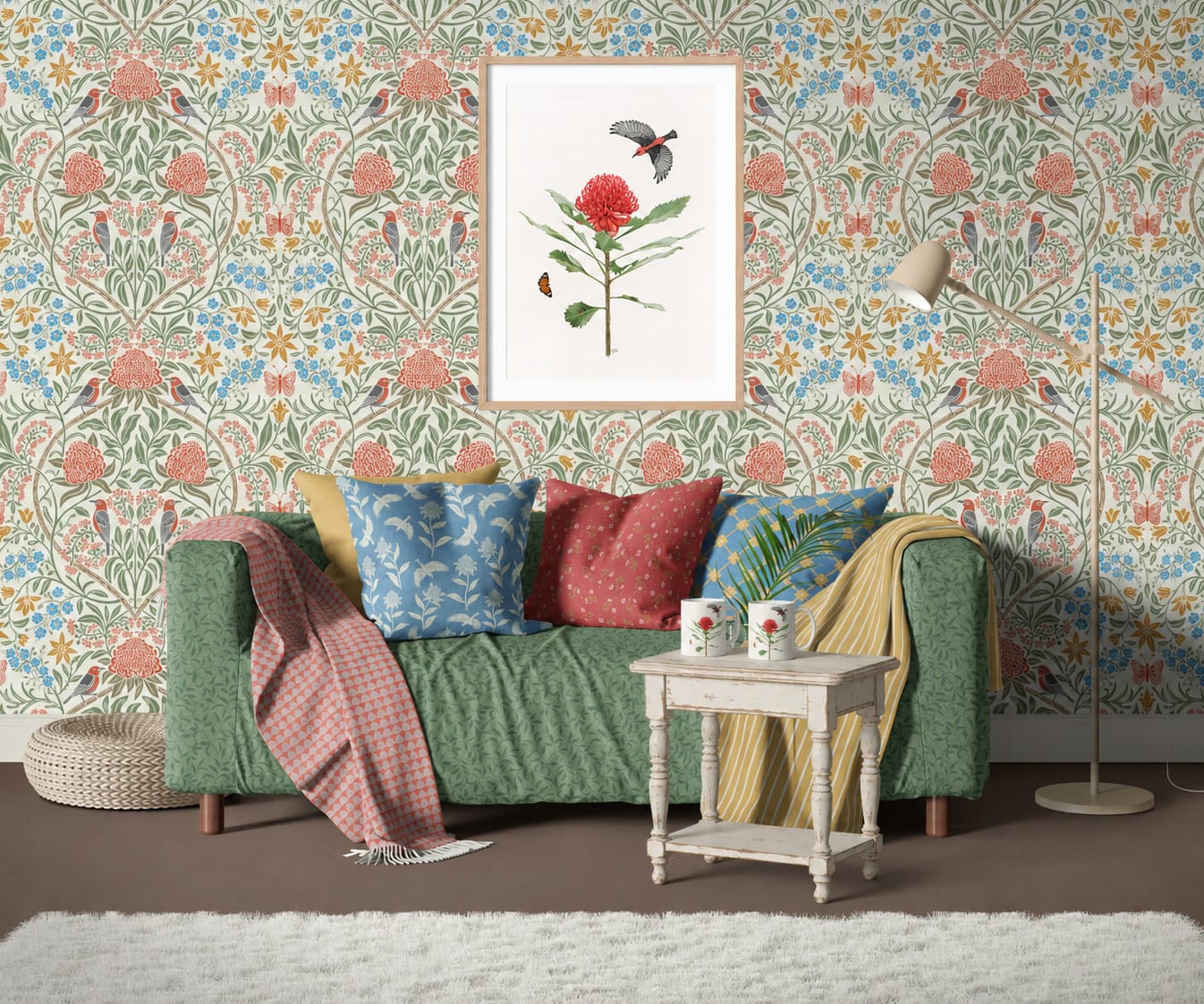 Framed watercolour print of an Australian waratah and honeyeater bird, displayed above a green sofa with floral cushions